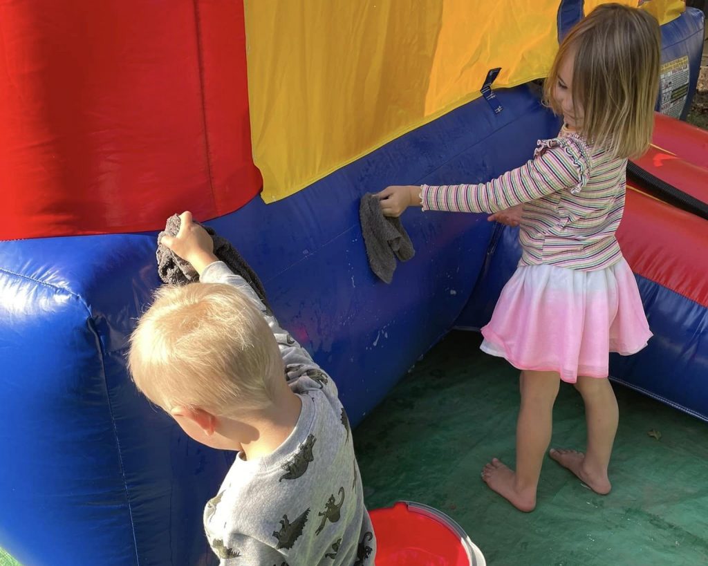 Kids cleaning bounce house rental.