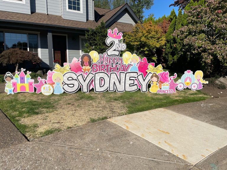 Sydney Birthday Deluxe Yard Card Lawn Display Princess Theme with pink and yellow balloons.